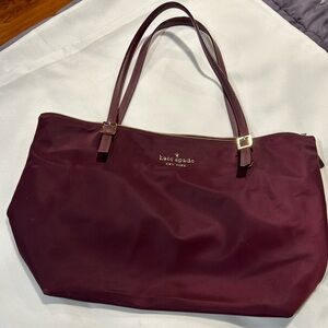 Gently used nylon KATE SPADE TOTE in beautiful burgundy color, gold hardware